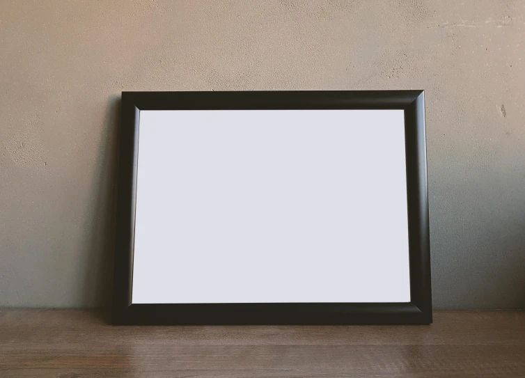a picture frame sitting on top of a wooden table, a poster, pexels, background image, black furniture, whiteboard, low quality photograph