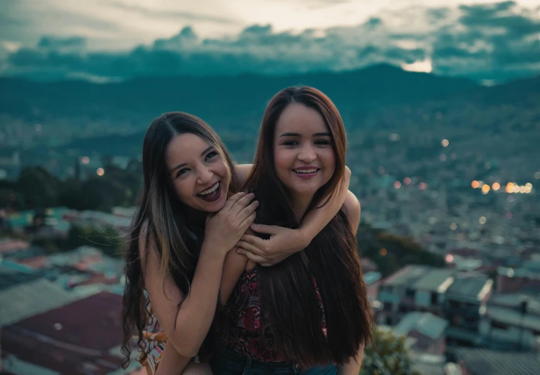 a couple of women standing next to each other, pexels contest winner, happening, coban, pokimane, on top of it, smiling at camera