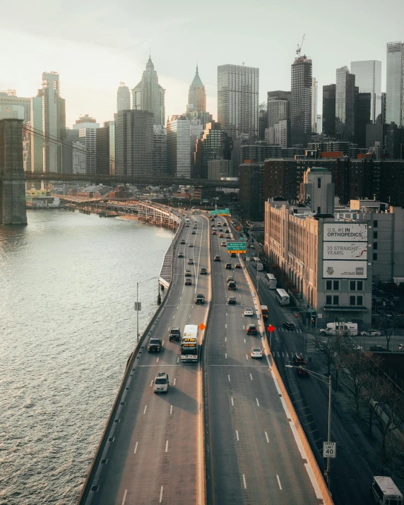 a view of a city from the top of a bridge, lgbtq, accurate roads, attacking nyc, high quality image”