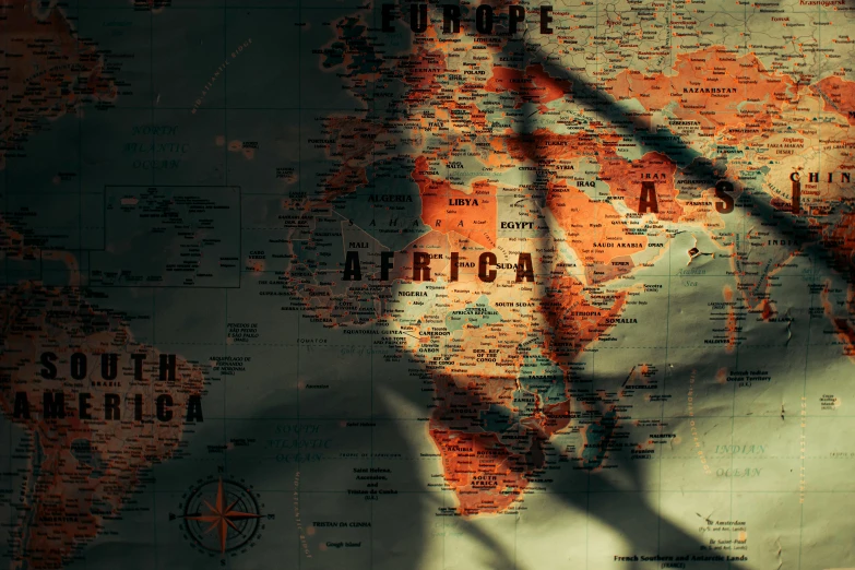 a close up of a map of the world, an album cover, by Daniel Lieske, pexels contest winner, african, shadow play, xenophobia, back - lit