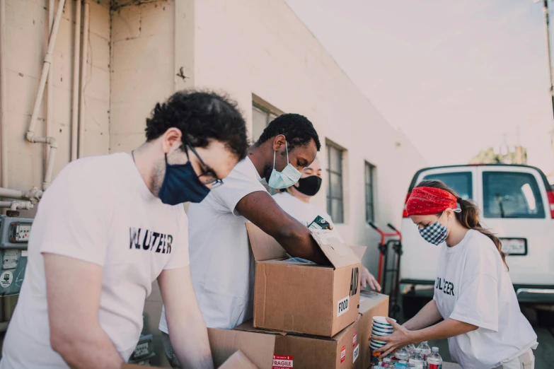 a group of people loading boxes onto a truck, pexels contest winner, renaissance, hunger, avatar image, los angeles ca, wearing a mask