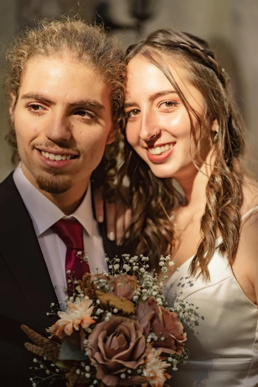a man and a woman posing for a picture, a colorized photo, by Lucia Peka, pexels contest winner, bouquet, headshot, well detailed, looking straight into the camera