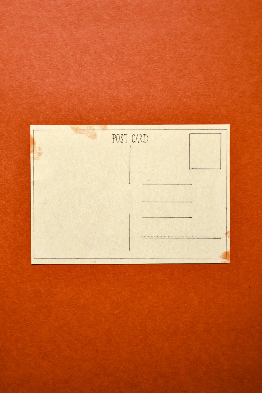 a close up of a postcard on an orange background, unsplash, dull red, ((rust)), square, historical archive