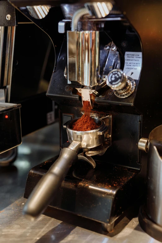 a close up of a coffee machine on a counter, thumbnail, ignant, cinamtic, plating