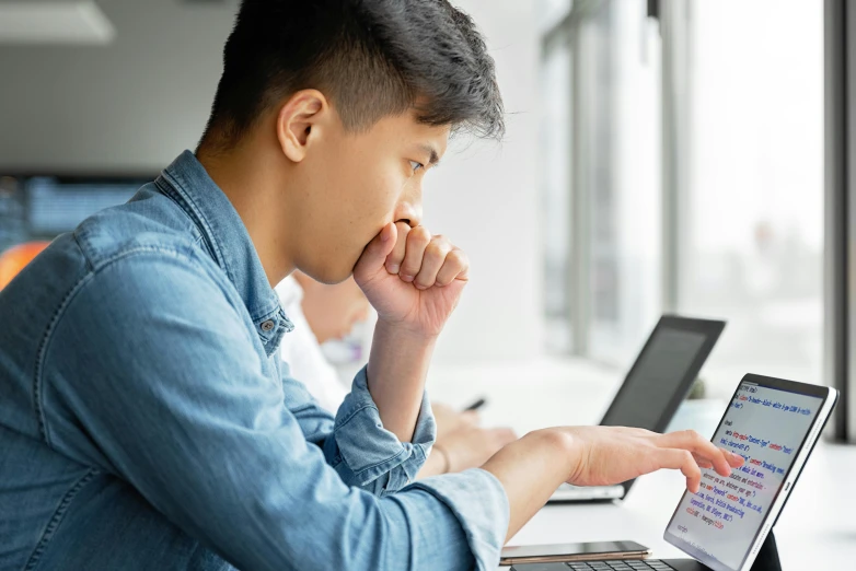 a man sitting in front of a laptop computer, trending on pexels, jin shan and ross tran, pensive expression, student, thumbnail