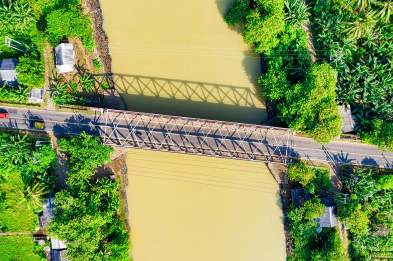 an aerial view of a bridge over a river, pexels contest winner, puerto rico, thumbnail, vietnam, railway tracks going through it