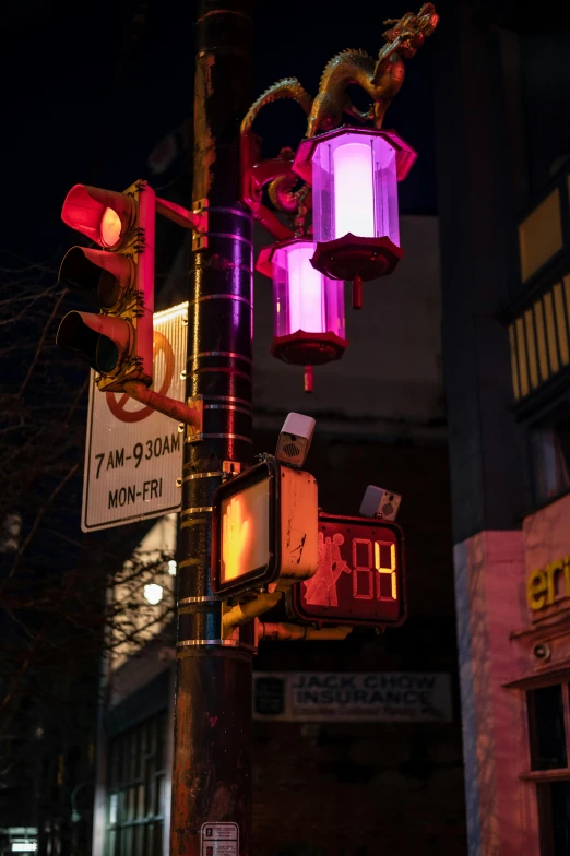 a traffic light sitting on the side of a road, a photo, by Doug Ohlson, kinetic art, chinatown bar, purple ambient light, warm light, pink