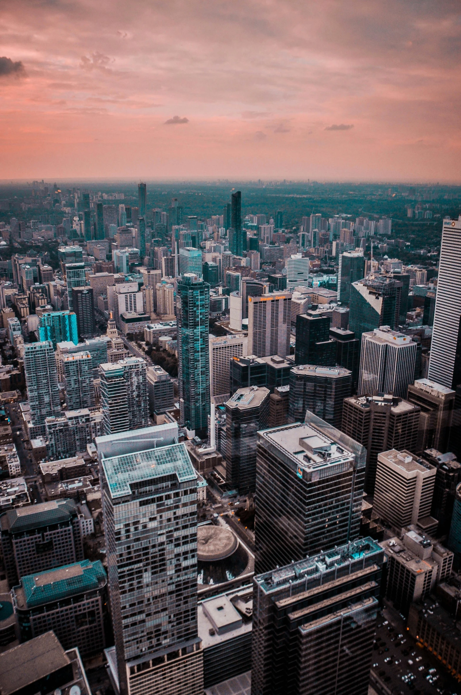 an aerial view of a city at sunset, by Seb McKinnon, pexels contest winner, cn tower, instagram post, upright, low detailed