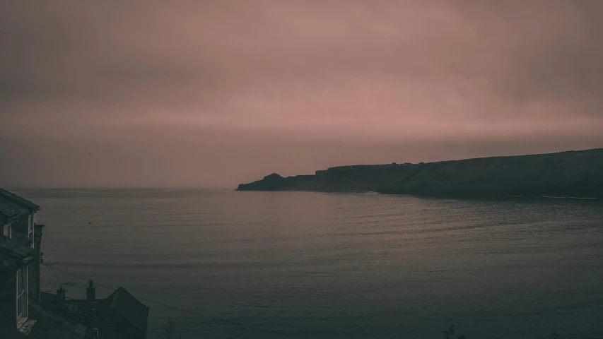 a black and white photo of the ocean, pexels contest winner, tonalism, faded pink, pembrokeshire, eerie color, desktop wallpaper