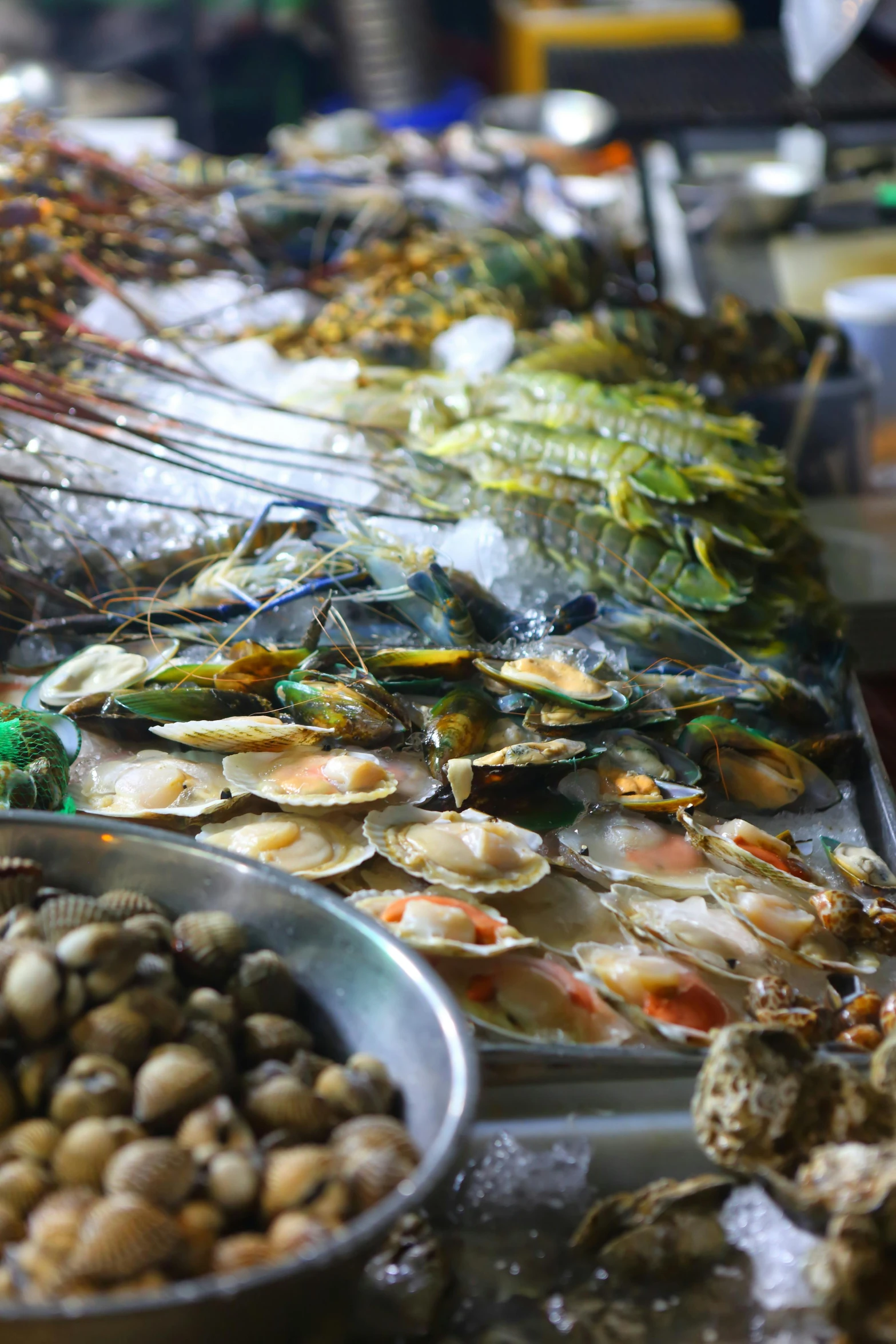 a table topped with lots of different types of food, underwater market, paua shell, tang mo, upclose