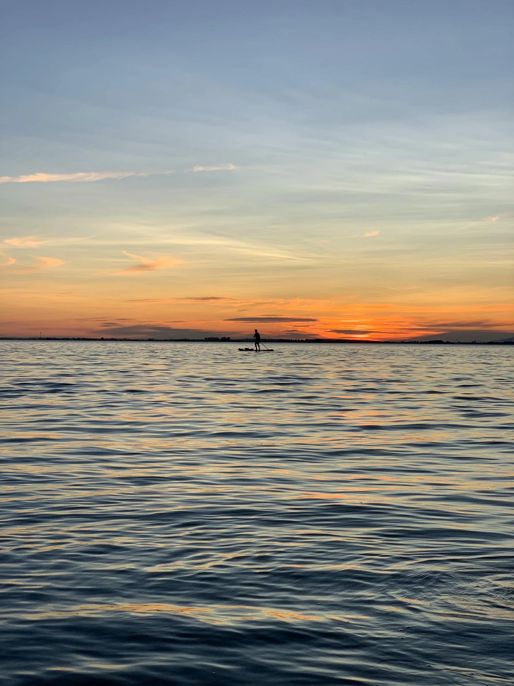 a large body of water with a boat in the distance, by Jan Tengnagel, pexels contest winner, sunset panorama, paddle of water, seattle, high quality photo