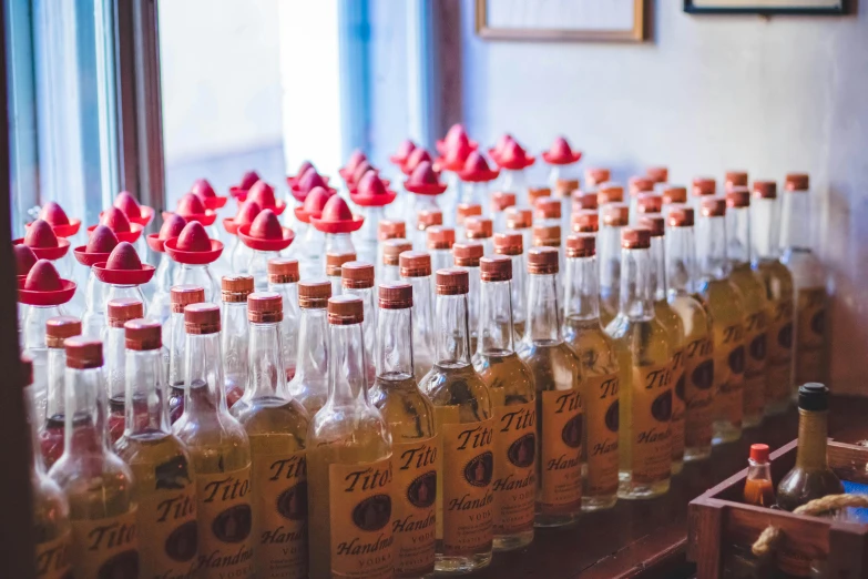 a bunch of bottles sitting on top of a table, profile image, fan favorite, mexico, syrup