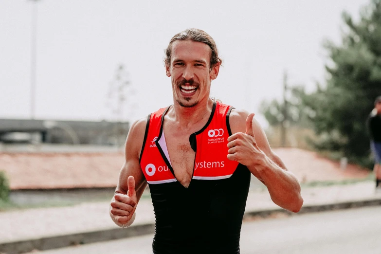 a man standing on the side of a road giving a thumbs up, inspired by Quirijn van Brekelenkam, happening, ironman, profile image, sweaty face, avatar image