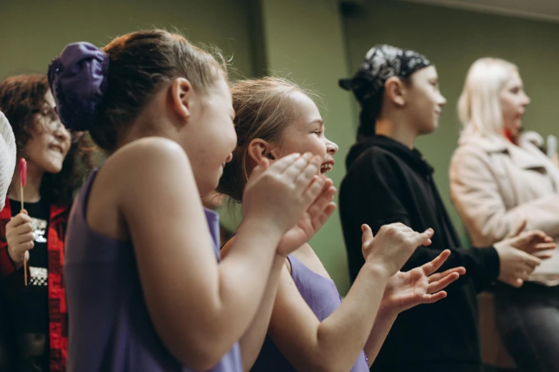 a group of young women standing next to each other, by Lee Loughridge, happening, dance, profile image, kids, hands