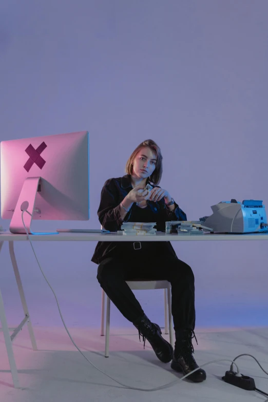 a woman sitting at a desk in front of a computer, an album cover, by artist, computer art, xqc, teenage engineering moad, photo from a promo shoot, plain background