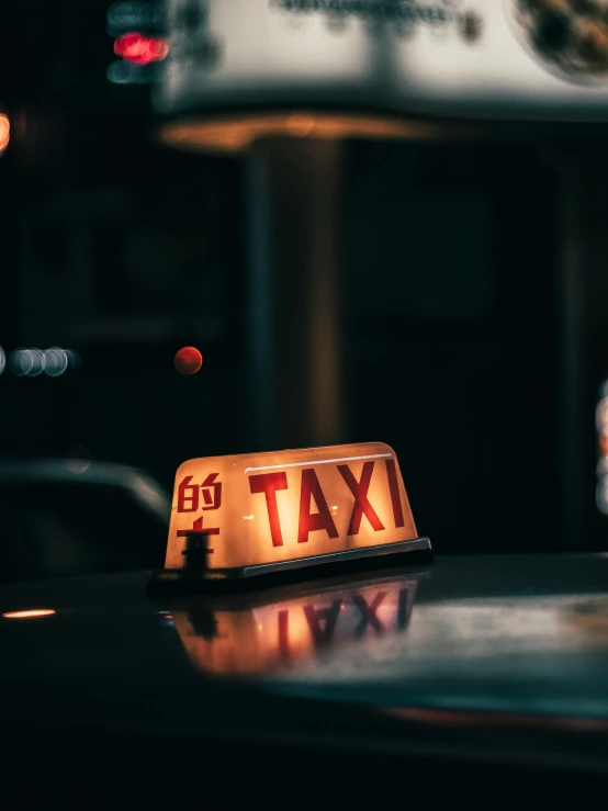 a taxi sign sitting on top of a car, pexels contest winner, happening, under light, 🚿🗝📝