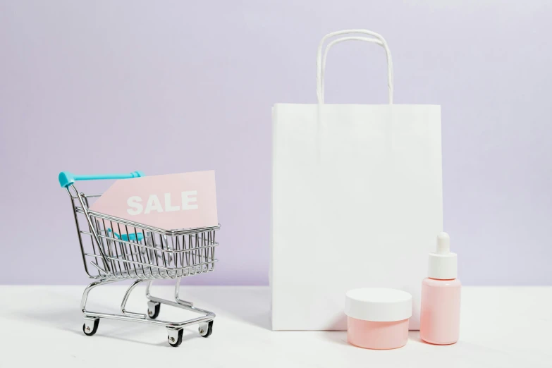 a shopping cart sitting next to a bottle of lotion, trending on pexels, aestheticism, paper cutouts of plain colors, white and purple, no - text no - logo, white powder makeup