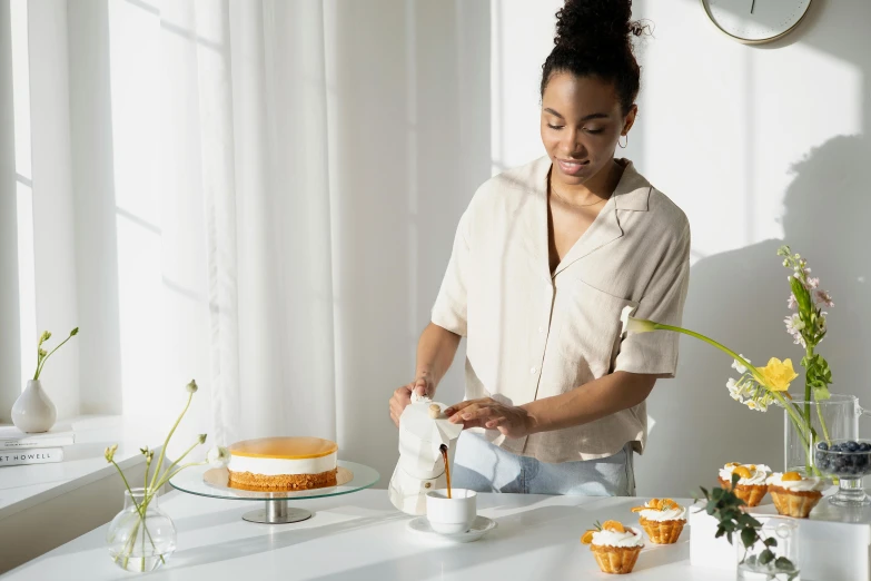 a woman is decorating a cake on a table, trending on pexels, white waist apron and undershirt, thumbnail, milk and mocha style, full body image