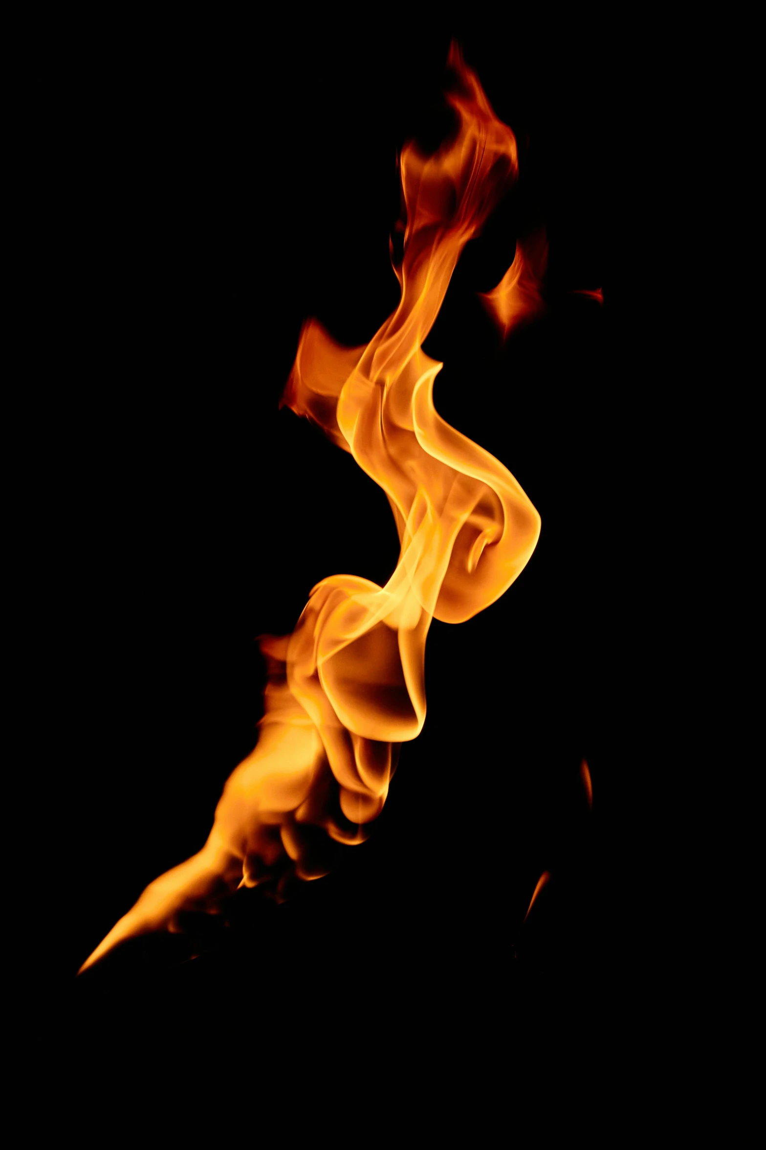 a close up of a fire on a black background, by Jan Rustem, pexels, profile image, ilustration, twisting vapour, tall