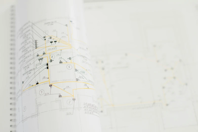 a close up of a book with drawings on it, a wireframe diagram, pexels, electrical details, slightly blurred, map, high resolution print :1 cmyk :1