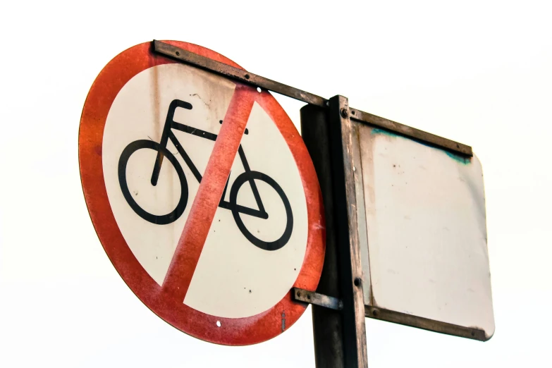a close up of a street sign on a pole, unsplash, plasticien, bicycles, no - text no - logo, getty images, profile image