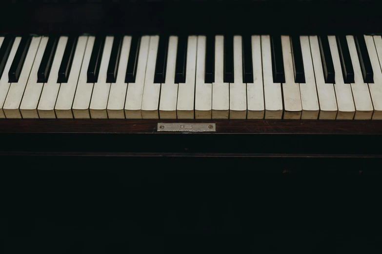 a close up of the keys of a piano, an album cover, by Carey Morris, unsplash, muted, brown, long, instagram post