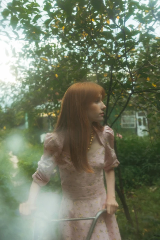 a woman in a pink dress holding a tennis racquet, an album cover, inspired by Elsa Bleda, magical realism, long ginger hair, 4 k photo autochrome, see - through, park ji-min