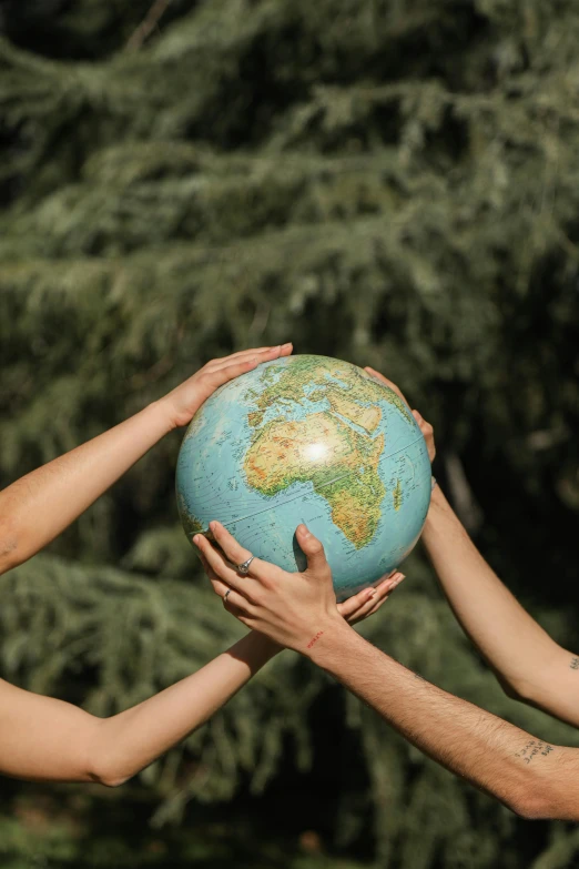 a couple of people that are holding a globe, no crop, biodiversity, thumbnail, earthwave