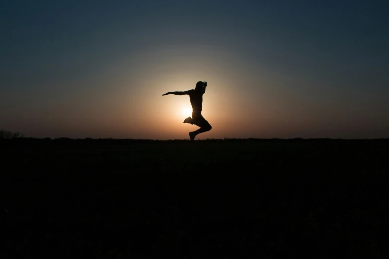 a silhouette of a person jumping in the air, by Jesper Knudsen, sunset lighting 8k, unbeatable quality, rectangle, dance meditation