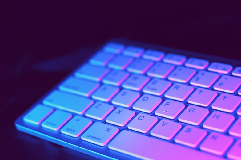 a computer keyboard sitting on top of a table, inspired by Beeple, unsplash, computer art, blue and purple lighting, profile picture 1024px, close - up photograph, instagram post