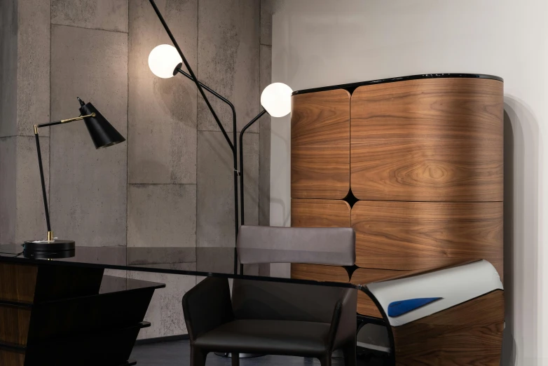 a room with a desk a chair and a lamp, a portrait, inspired by Bauhaus, unsplash, two moons lighting, street corner, high-quality photo, show room scene