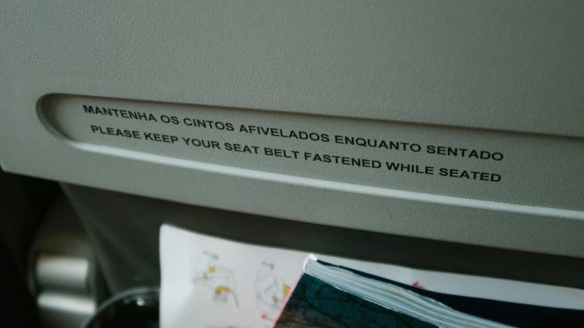 a close up of a seat on a plane, by Elsa Bleda, serial art, instructions, grey, in sao paulo, y2k”
