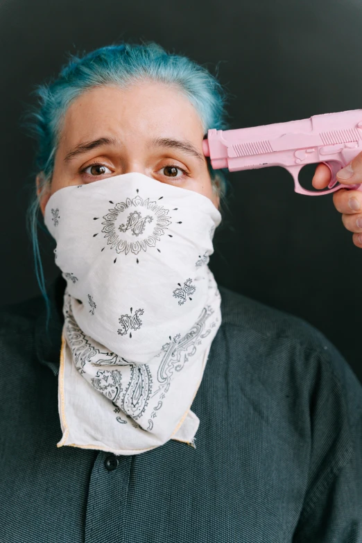 a woman with blue hair holding a pink gun, by Winona Nelson, trending on unsplash, renaissance, black bandana mask, portrait of sam hyde, terrified, ethan klein