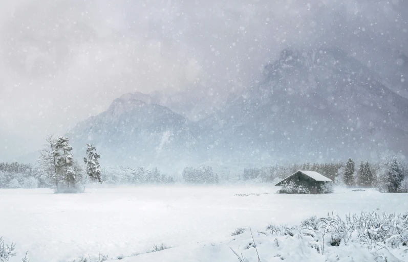 a snow covered field with a mountain in the background, a matte painting, pexels contest winner, magical realism, background image, old cabin, snow falling, 8 k