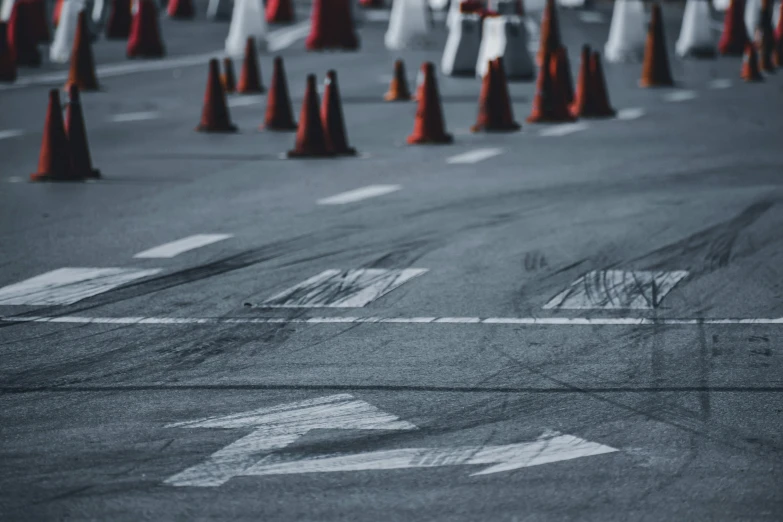 a parking lot filled with lots of traffic cones, pexels contest winner, visual art, on a street race track, initial d, thumbnail, very grainy image