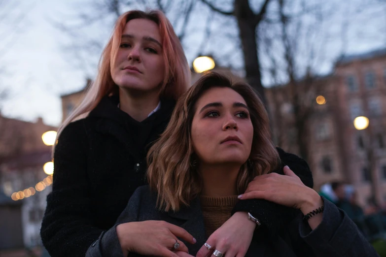 a couple of women standing next to each other, a photo, trending on pexels, antipodeans, bisexual lighting, portrait image, album art, pokimane