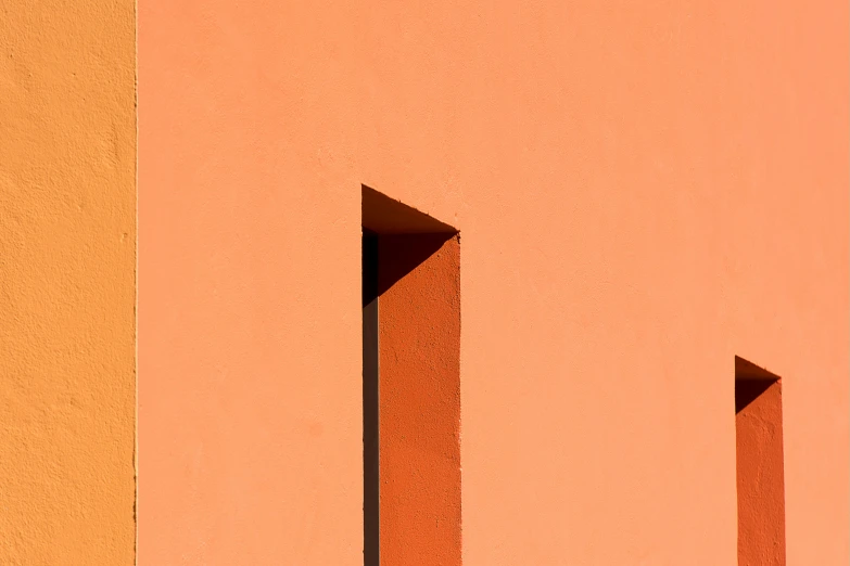 a red fire hydrant sitting on the side of a building, a minimalist painting, inspired by Ricardo Bofill, postminimalism, orange line, keyhole, ignant, angular minimalism