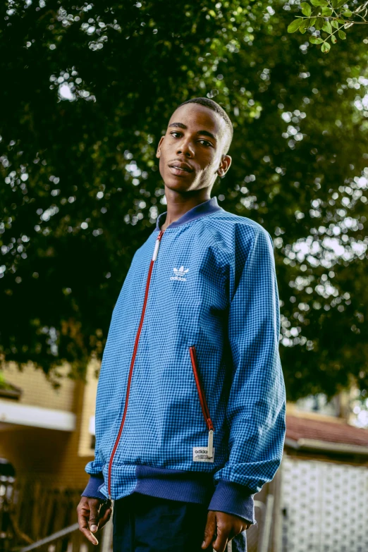 a man in a blue jacket holding a tennis racquet, addidas, teddy fresh, wearing a bomber jacket, profile image