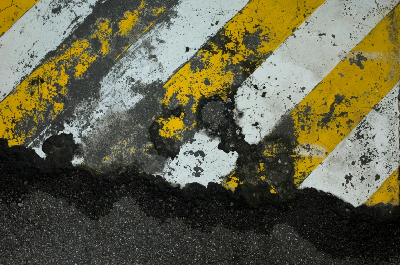 a red fire hydrant sitting on the side of a road, an album cover, unsplash, concrete art, black. yellow, oil spill, striped, detailed abstract