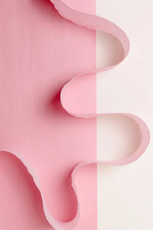 a pair of pink slippers sitting on top of a pink and white surface, an abstract sculpture, inspired by Lucio Fontana, trending on pexels, made of paper, detail shot, kirigami, half image