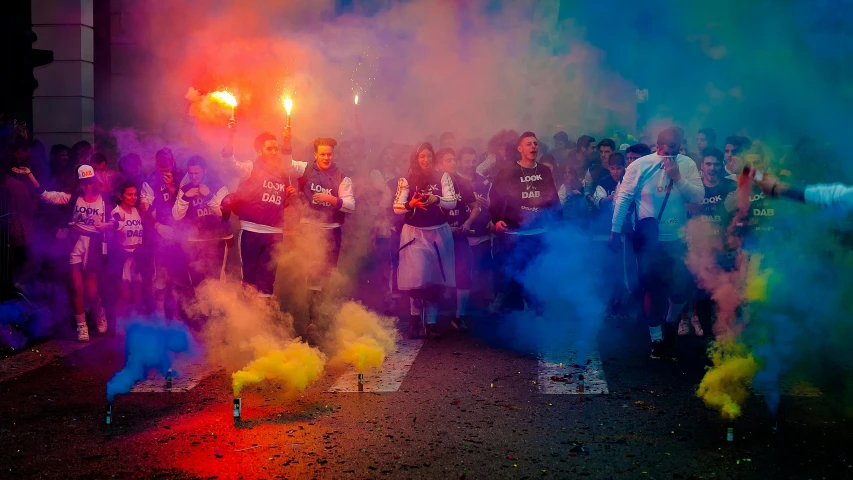 a group of people standing next to each other on a street, by Gina Pellón, pexels contest winner, :6 smoke grenades, football hooligans, colourful light, argentina presidential rally