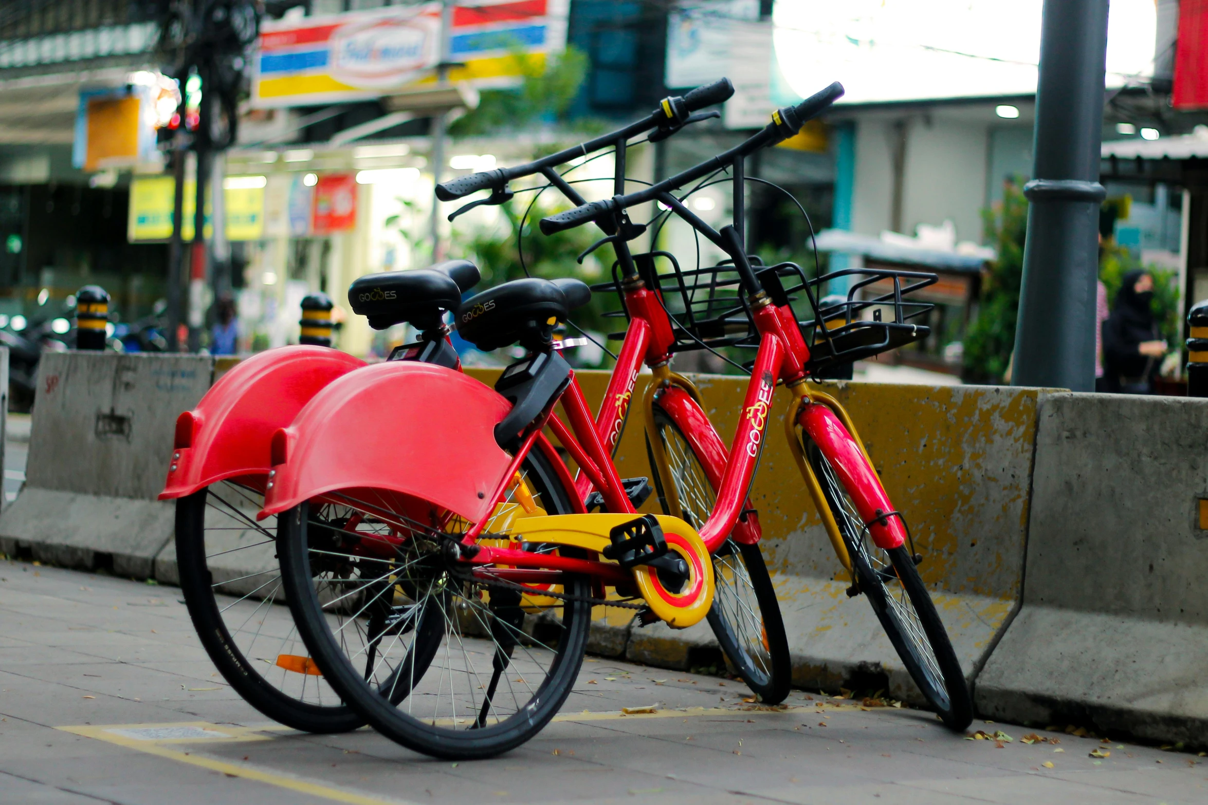 a red bike parked on the side of a street, pink and yellow, patiphan sottiwilaiphong, avatar image, two