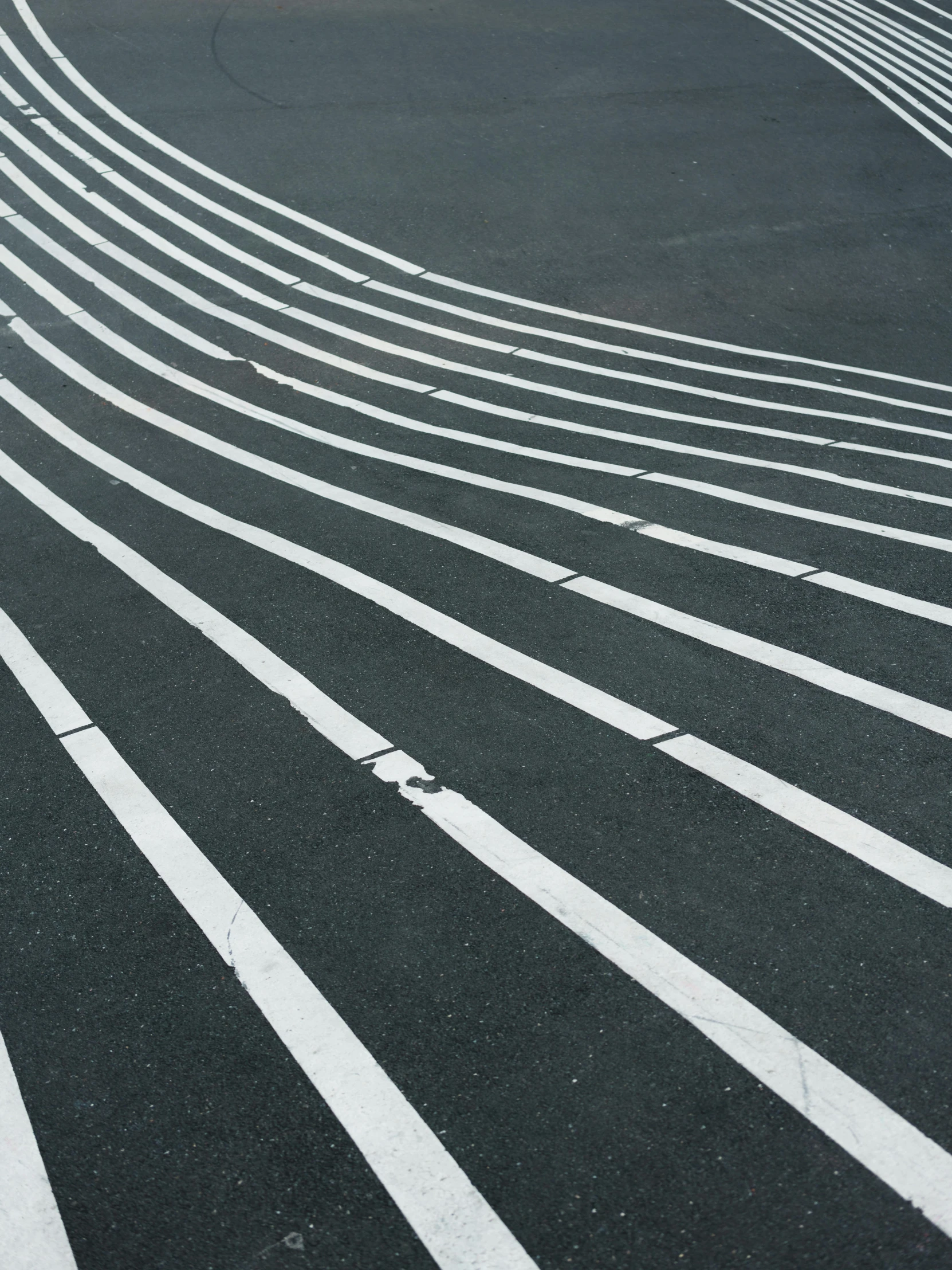 a black and white photo of a curved road, an album cover, by Carey Morris, pexels contest winner, postminimalism, square lines, sports photo, finely painted, steps