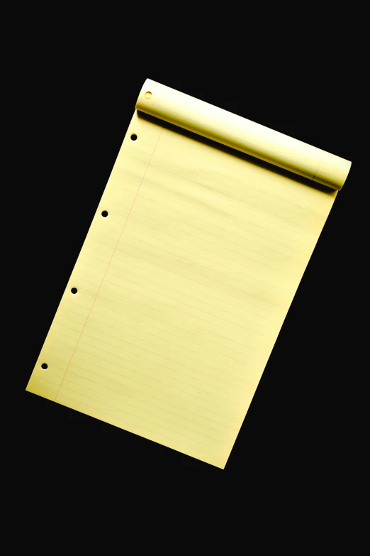 a roll of gold paper on a black background, writing on a clipboard, in 2 0 0 2, f / 1 1, - n 9
