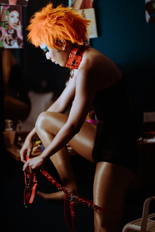 a woman with orange hair sitting on a chair, inspired by Nan Goldin, trending on pexels, afrofuturism, harnesses and garters, bedazzled, panoramic view of girl, copper short hair