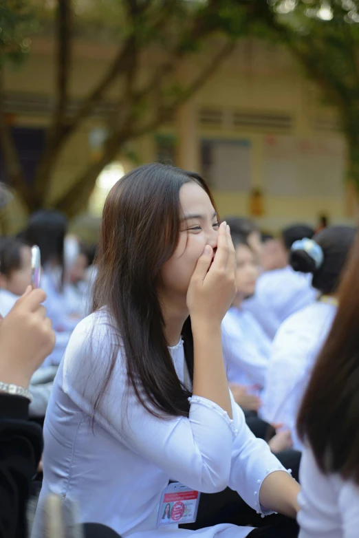 a group of women sitting next to each other, a picture, trending on unsplash, happening, vietnam, facepalm, wearing white shirt, high school