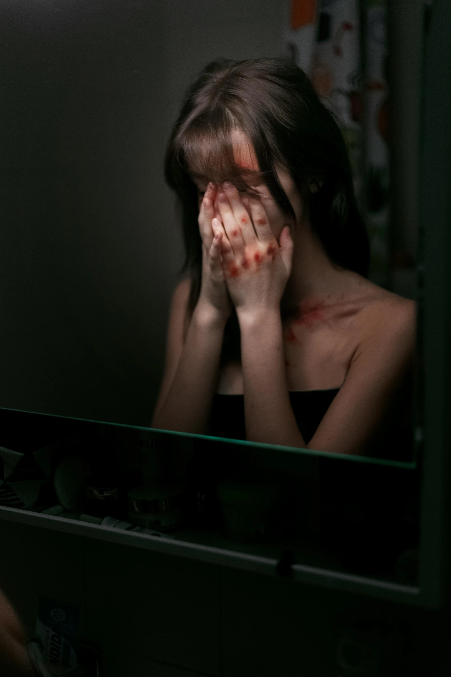 a woman holding her face in front of a mirror, a picture, inspired by Elsa Bleda, shutterstock, crying blood, personal computer horror, abused, ilustration