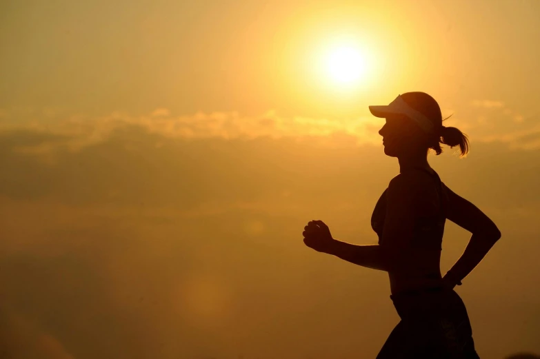 a silhouette of a woman running at sunset, pexels contest winner, figuration libre, workout, on a sunny day, sweating, rectangle