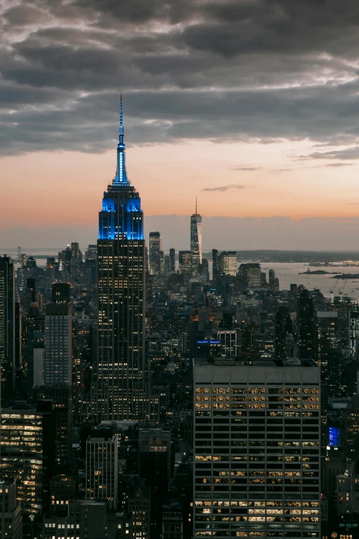 a view of a city from the top of a building, golden and blue hour, empire state building, 4k press image