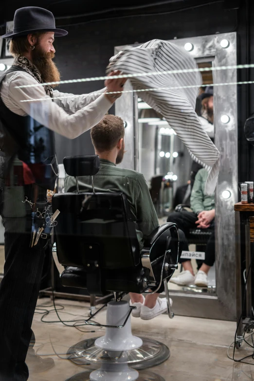 a man getting a haircut at a barber shop, by Julia Pishtar, trending on pexels, full growth from the back, thumbnail, ignant, lachlan bailey